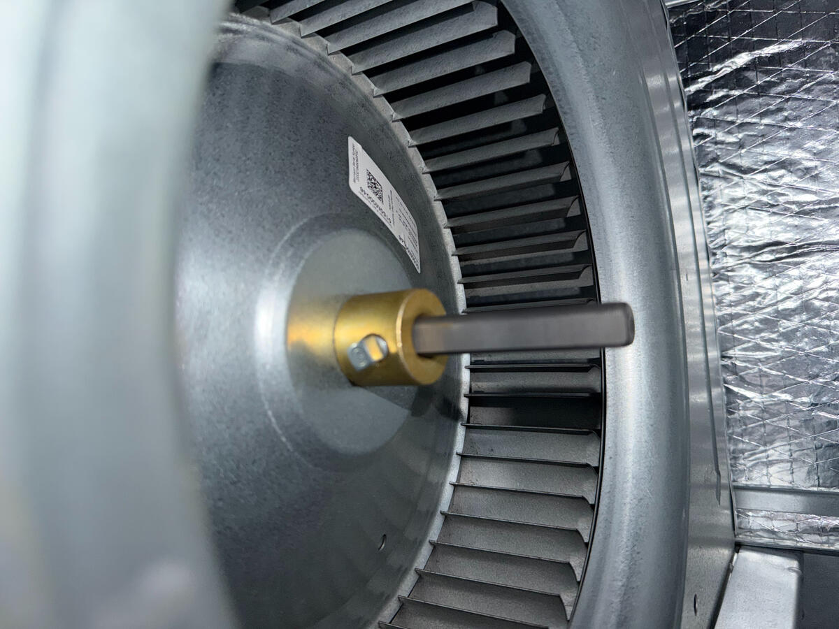 Efficiency starts with the details. This close-up of a high-performance HVAC blower motor shows the precision required during a professional parts replacement. By focusing on the technical health of your fan assembly, we keep your air moving efficiently an Efficiency starts with the details. This close-up of a high-performance HVAC blower motor shows the precision required during a professional parts replacement. By focusing on the technical health of your fan assembly, we keep your air moving efficiently an