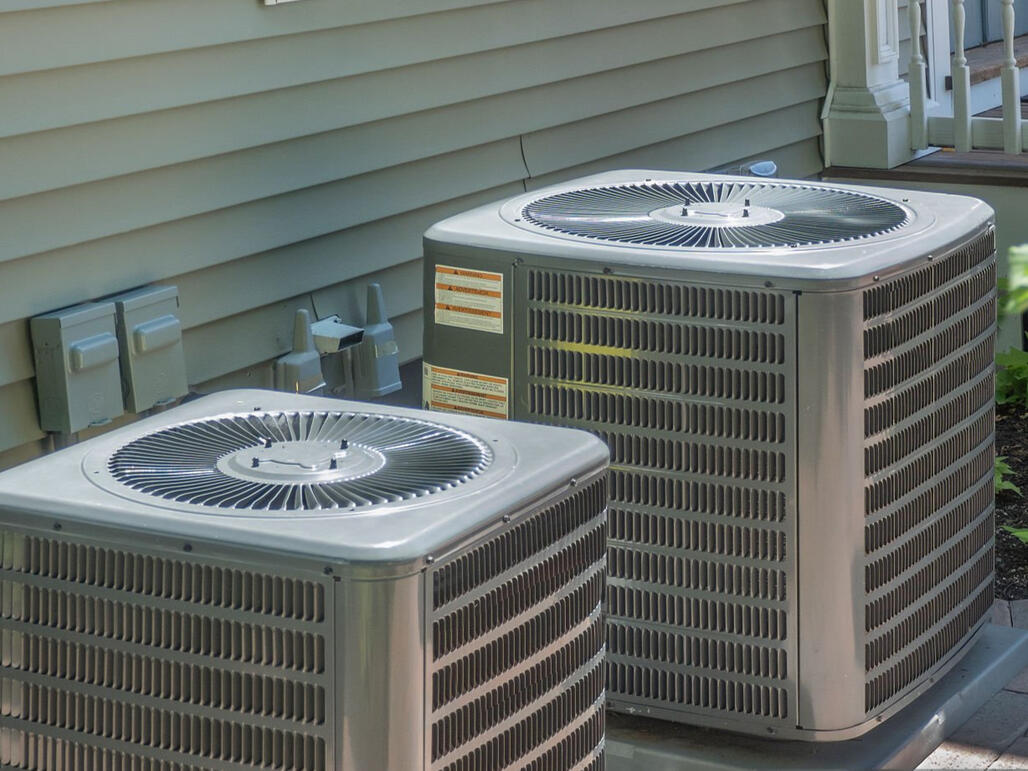 Boost your home's efficiency with a professional dual-system AC installation. This setup features two high-performance residential AC condenser units mounted on precision-leveled concrete pads to ensure maximum airflow and drainage. Boost your home's efficiency with a professional dual-system AC installation. This setup features two high-performance residential AC condenser units mounted on precision-leveled concrete pads to ensure maximum airflow and drainage.