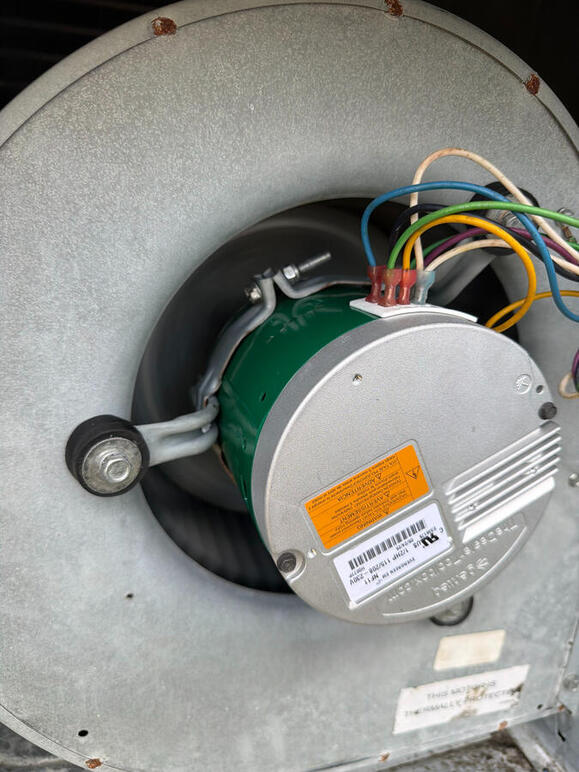 Efficiency starts with the details. This close-up of a high-performance HVAC blower motor shows the precision required during a professional parts replacement. By focusing on the technical health of your fan assembly, we keep your air moving efficiently. Efficiency starts with the details. This close-up of a high-performance HVAC blower motor shows the precision required during a professional parts replacement. By focusing on the technical health of your fan assembly, we keep your air moving efficiently.